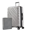 Platinum silver Ricardo Mojave check-in hardside suitcase with diagonal grooves shown with a large grey packing cube