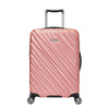 Rose gold Ricardo Mojave carry-on hardside suitcase with textured diagonal grooves and black accents