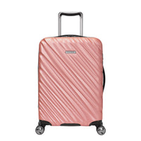 Rose gold Ricardo Mojave carry-on hardside suitcase with textured diagonal grooves and black accents