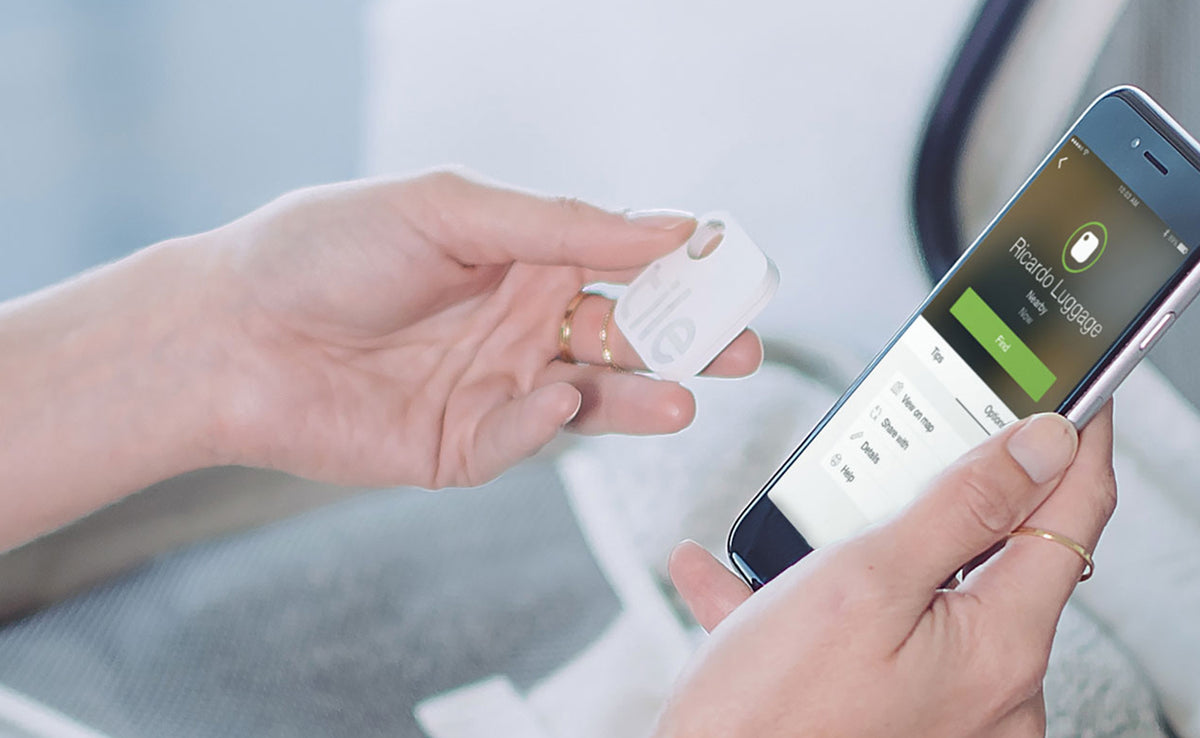Woman hand with smart phone and Tile