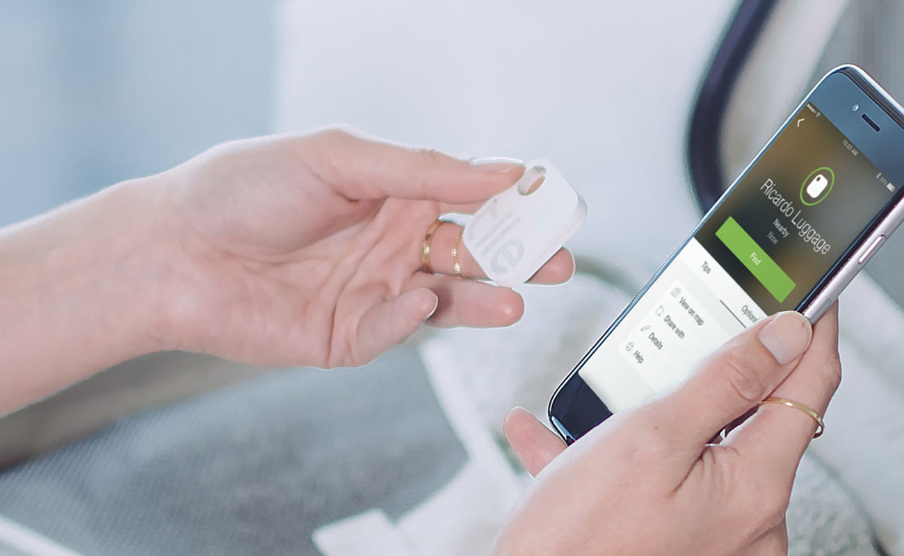 Woman hand with smart phone and Tile