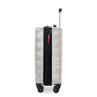 A hard-shell spinner suitcase in a metallic silver finish with a black front zipper track and a small red luggage tag, shown on a white background with its telescoping handle extended.