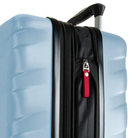 Close-up of a light blue hard-shell suitcase with a black telescoping handle, black zipper track, and a red zipper pull tab on a white background.