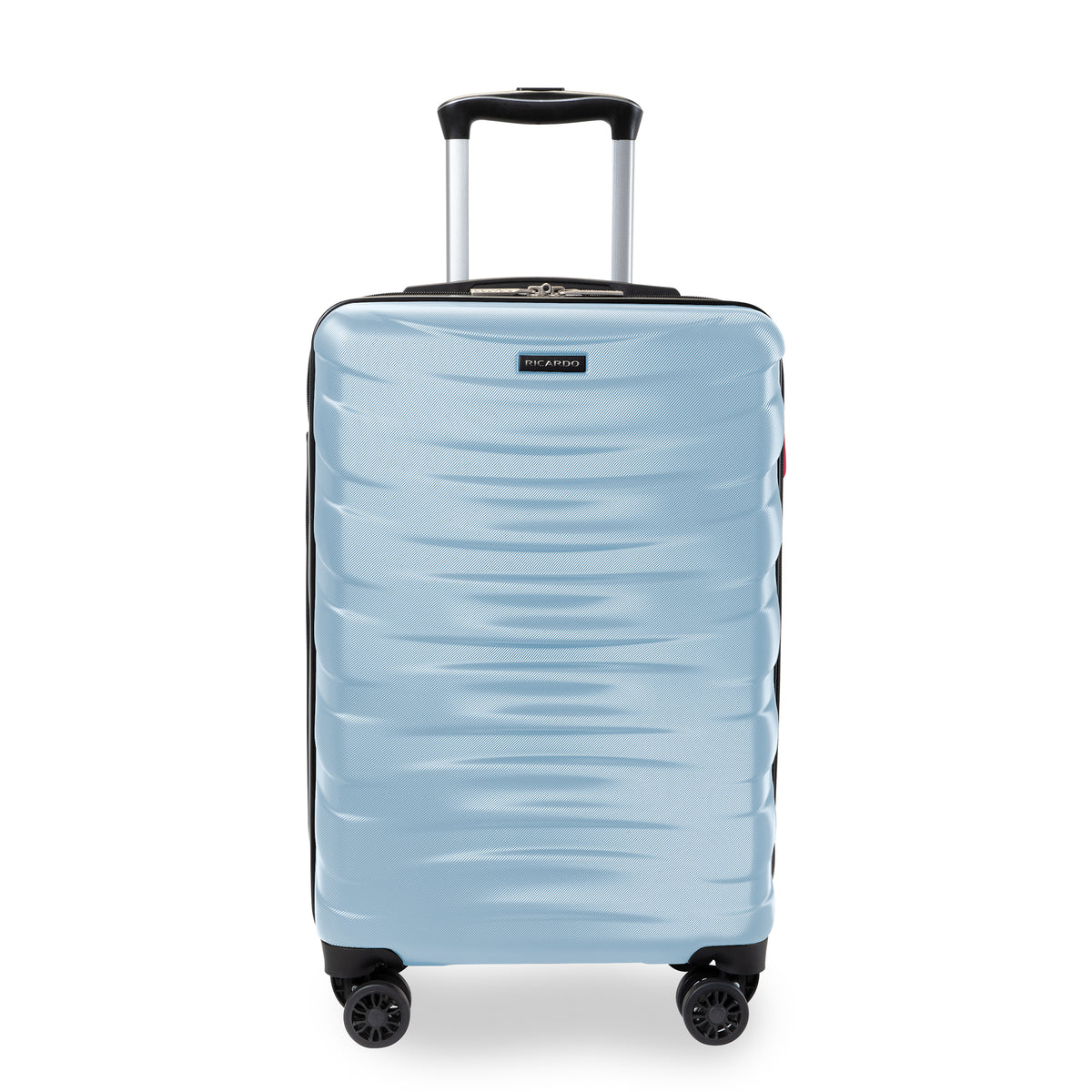 A light blue hardshell spinner suitcase with a textured wavy pattern, featuring a black telescoping handle and four multi-directional wheels, shown on a white background.