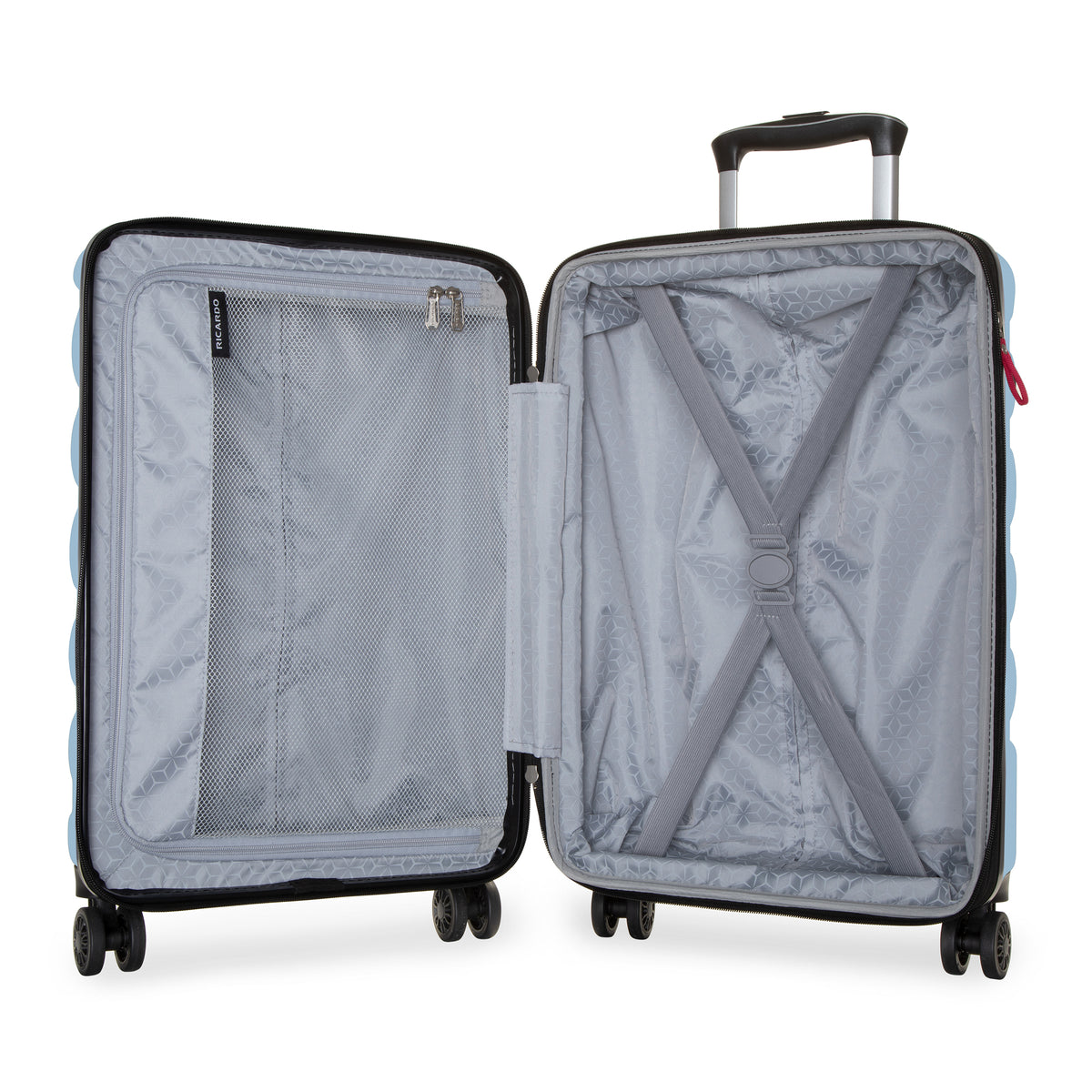An open hard-shell suitcase shown from the front, revealing a light gray patterned interior with a zippered compartment, mesh pocket, and X-strap compression system. The suitcase has a black telescoping handle and four wheels, set against a plain white background.