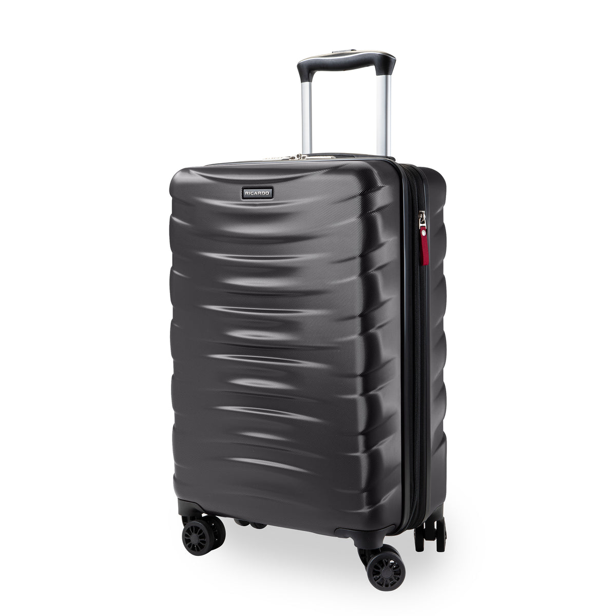 A dark gray hardside spinner suitcase with a textured wavy front panel, telescoping handle extended, and four wheels, shown on a white background.