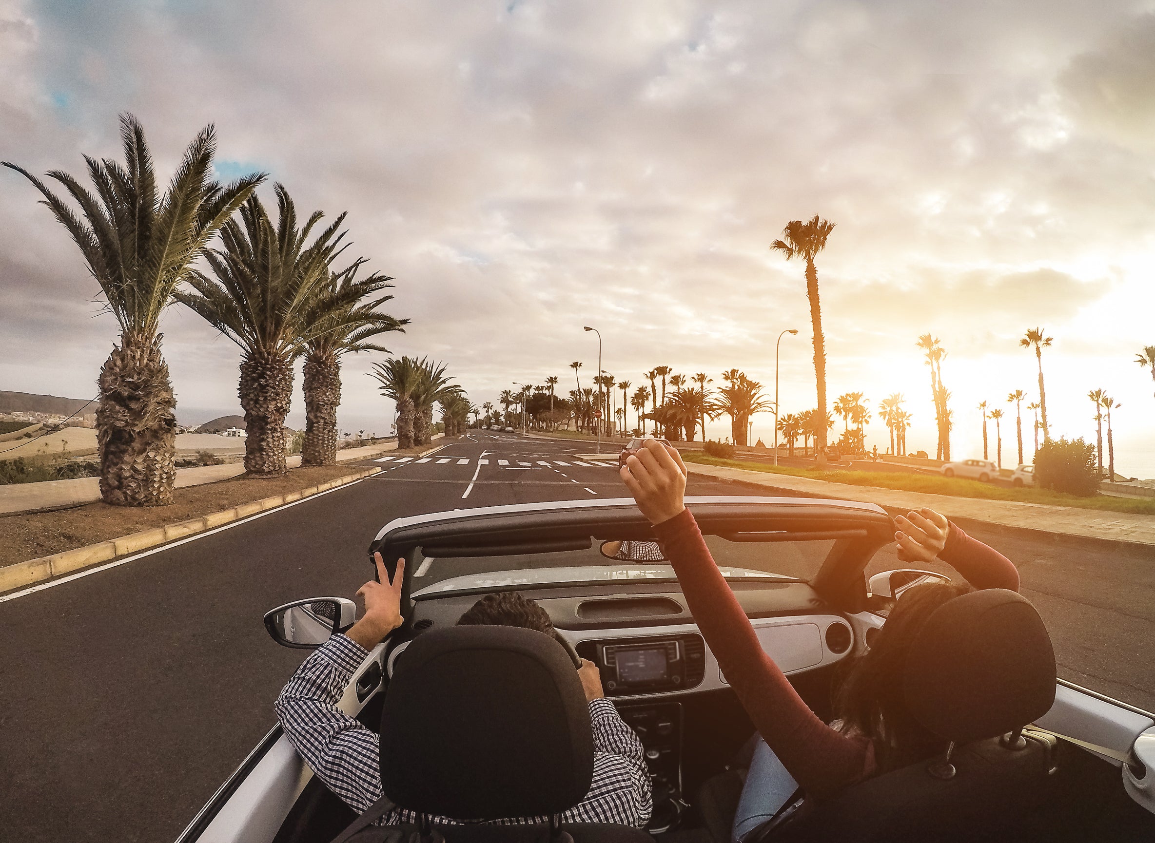 Driving in a convertible in the Southern California desert.