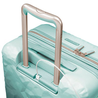 close up of USB charging port on mint green carry-on suitcase