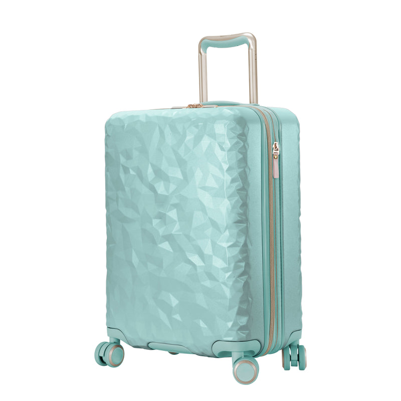 mint green hardside suitcase with a textured surface and metallic accents