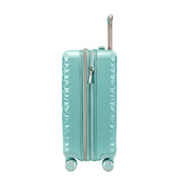 side view of mint green carry on suitcase with grey and metallic accents 