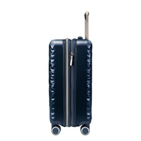side view of navy blue carry on suitcase with grey and metallic accents 