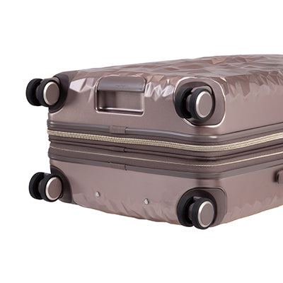 close up of  wheels on metallic topaz rolling check in luggage