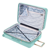 open Indio mint check-in suitcase with a blue and white fern pattern lining and navy blue compression straps