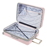 open Indio blush check-in suitcase with a blue and white fern pattern lining and navy blue compression straps