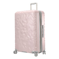 blush pink hardside suitcase with a textured surface and grey and metallic accents