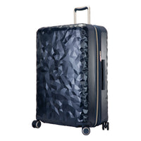 navy blue Indio hardside check-in suitcase with a textured surface and metallic accents