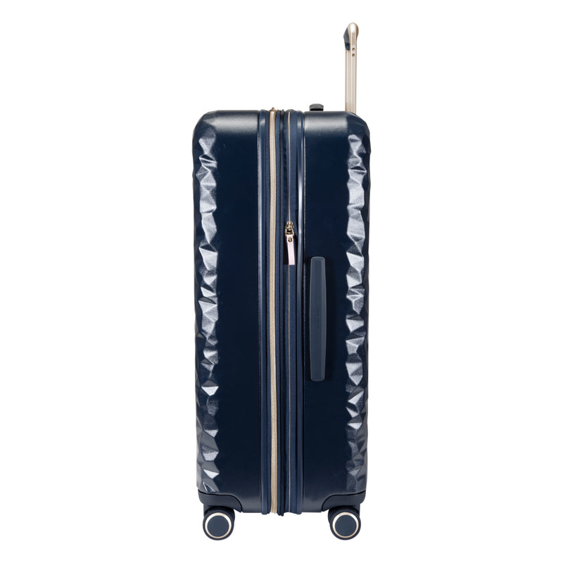 side view of Indio navy check in suitcase