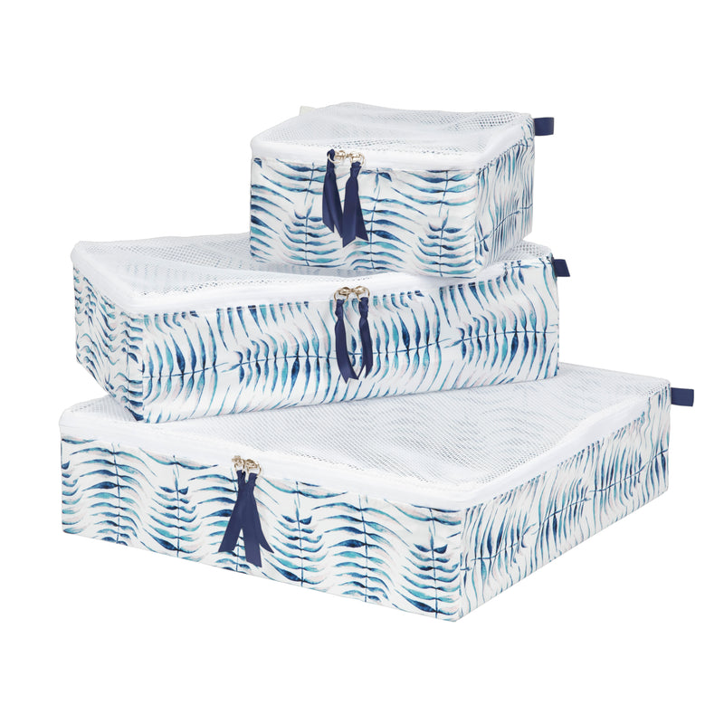 stack of three packing cubes in varying sizes with a blue and white fern frond pattern 