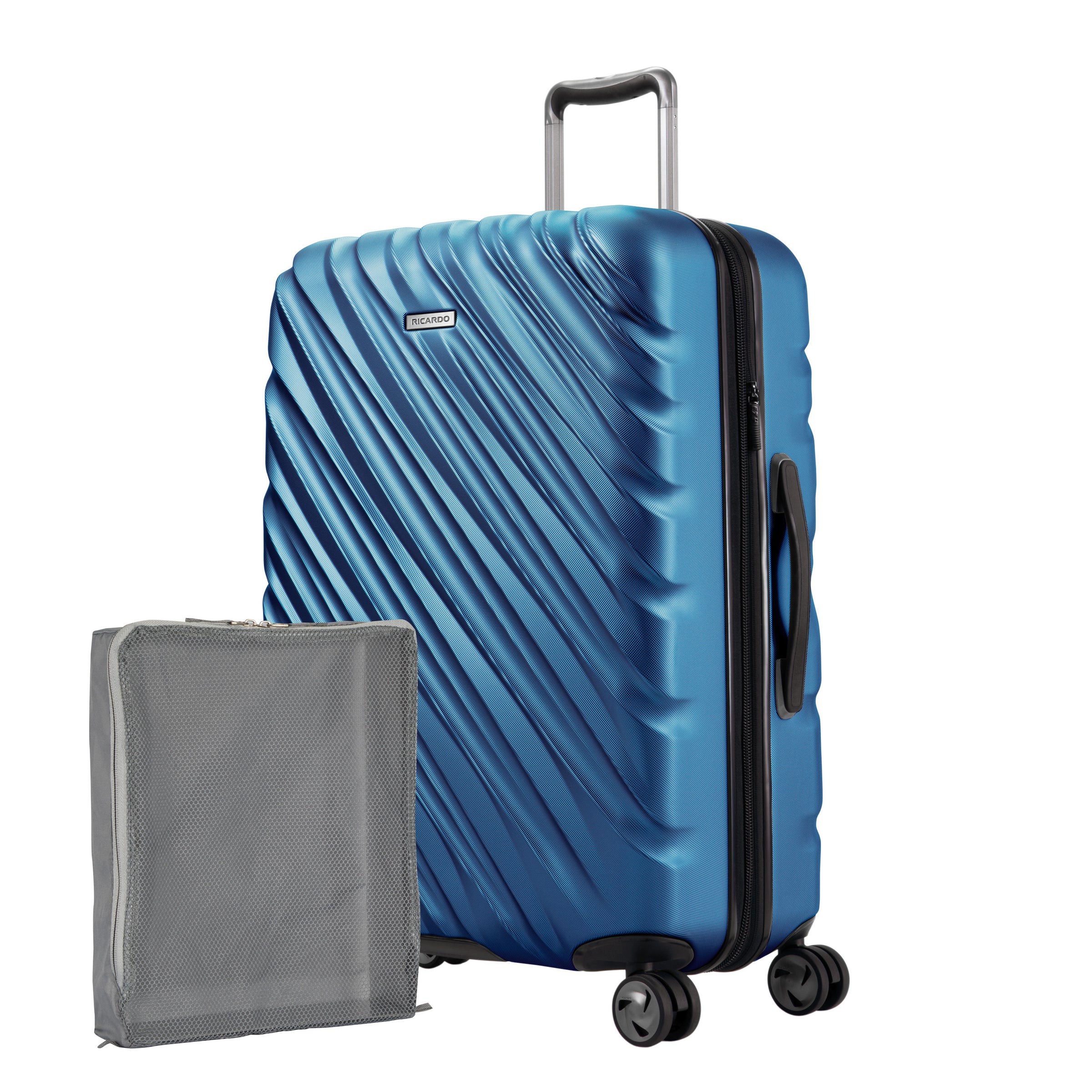Twilight Blue Ricardo Mojave check-in hardside suitcase with diagonal grooves shown with a large grey packing cube