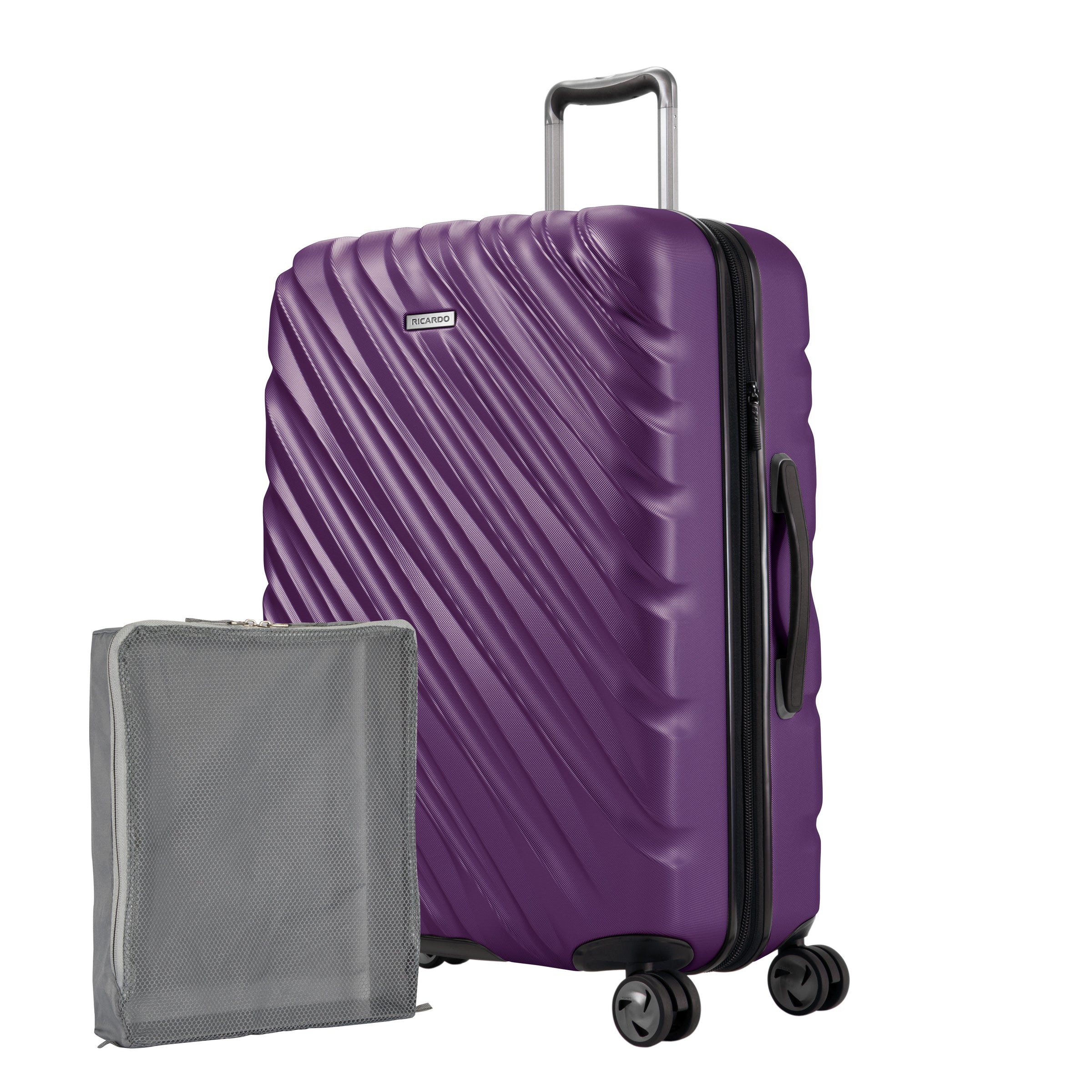 Aubergine purple Ricardo Mojave hardside suitcase with diagonal grooves shown with a large grey packing cube