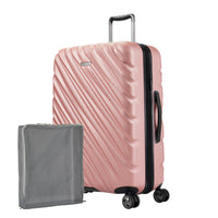 Rose gold Ricardo Mojave hardside suitcase with textured diagonal grooves and black accents shown with a large grey packing cube