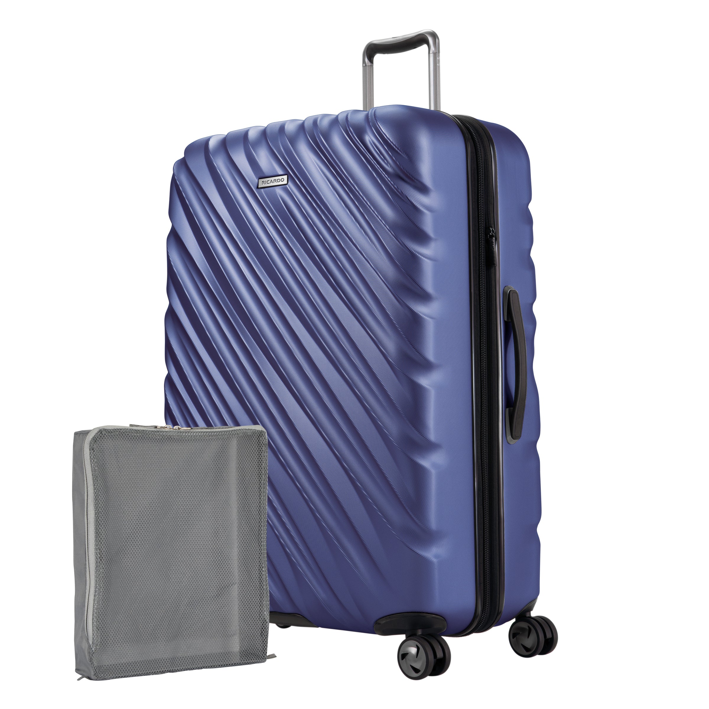 Maritime Blue Ricardo Mojave hardside suitcase with diagonal grooves shown with a large grey packing cube