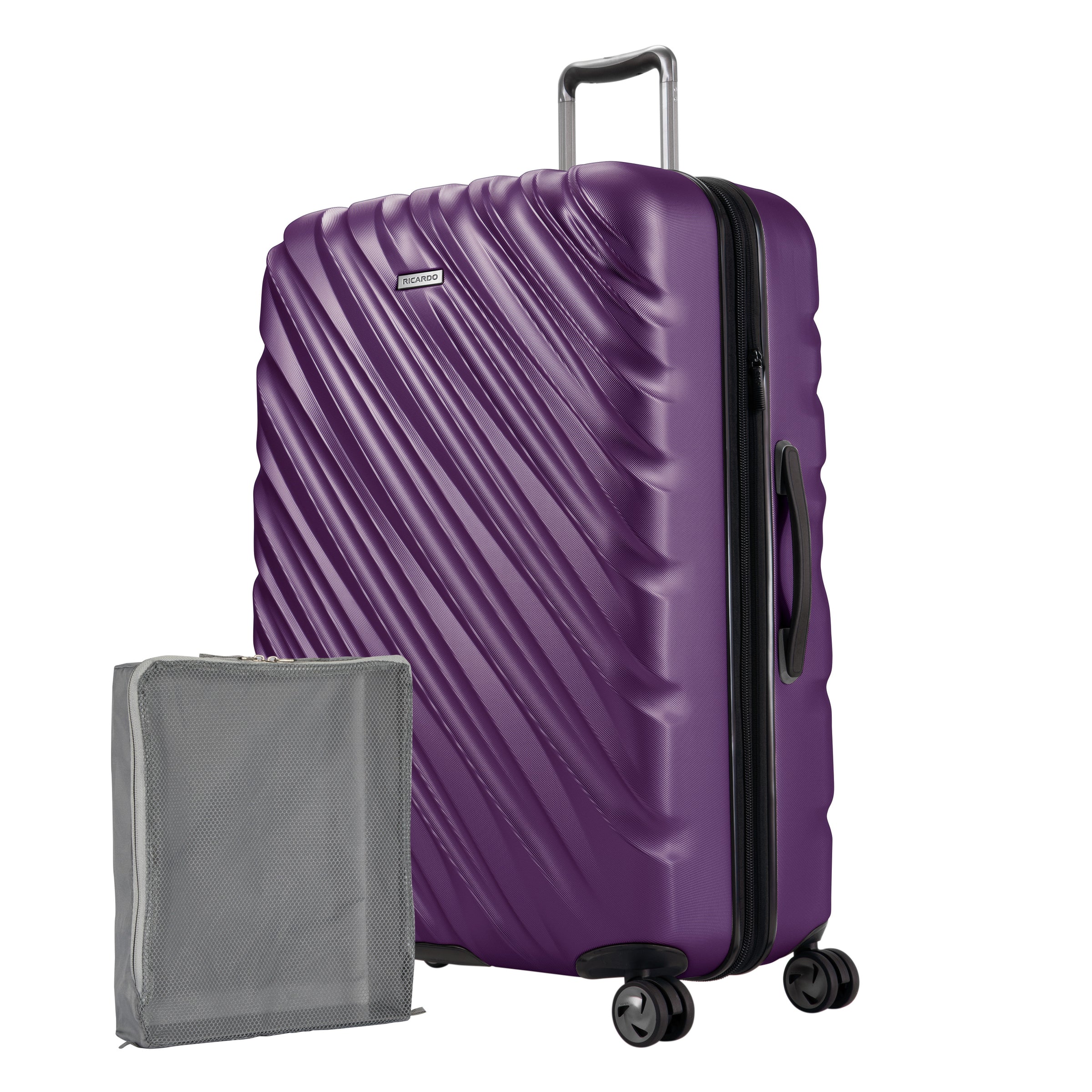 Aubergine purple Ricardo Mojave hardside suitcase with diagonal grooves shown with a large grey packing cube