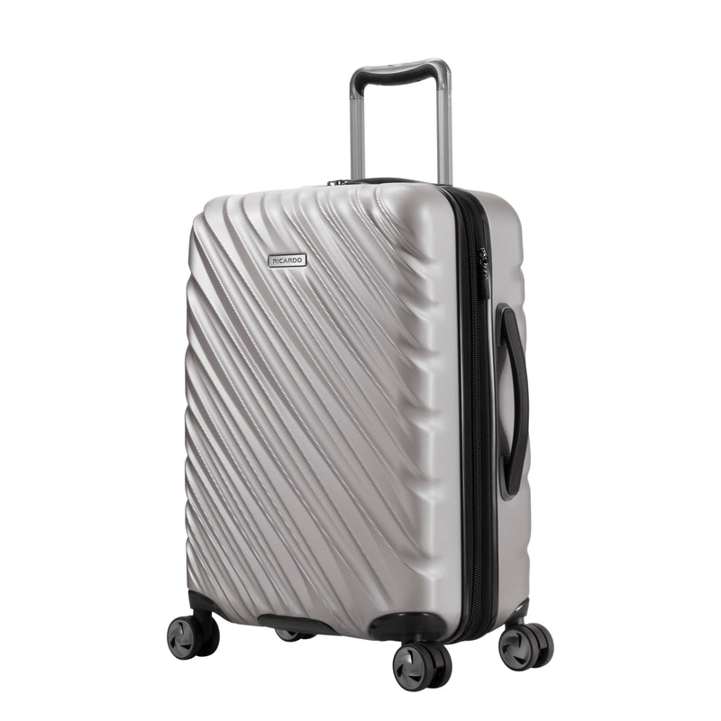 Platinum silver Ricardo Mojave carry-on with black wheels, zipper, and handles