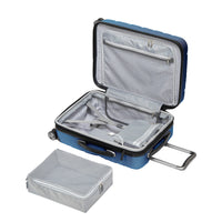 open blue Mojave carry-on with grey patterned lining, clear toiletries bag, and portable battery pouch shown with large grey packing cube