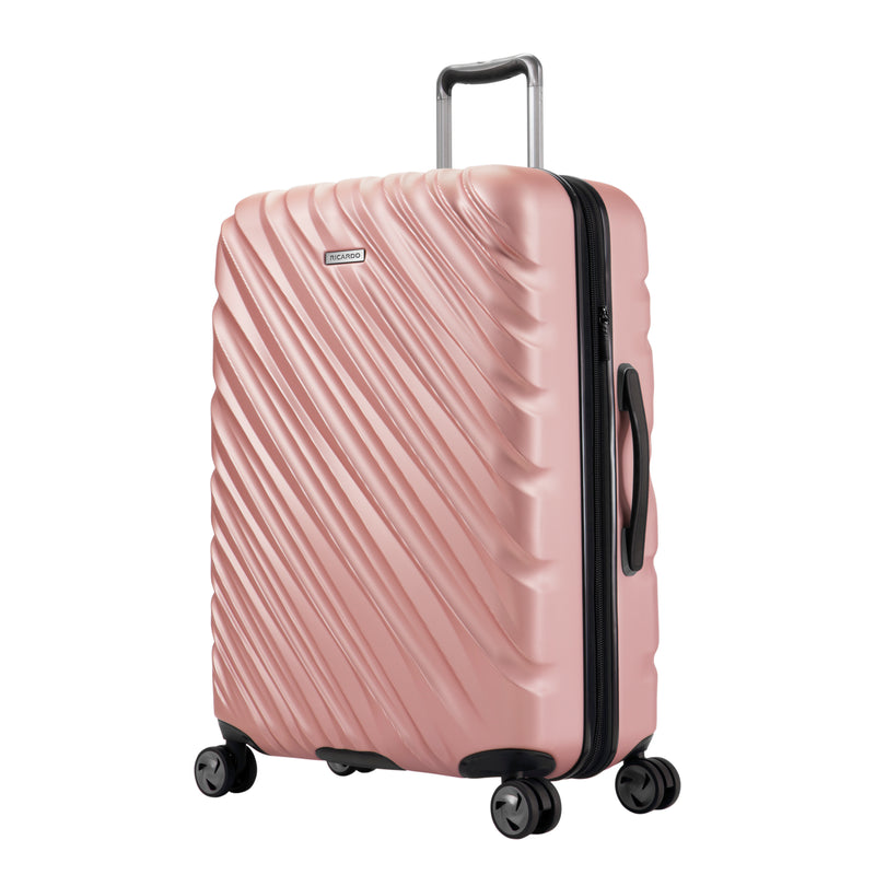 rose gold hardside suitcase with black accents